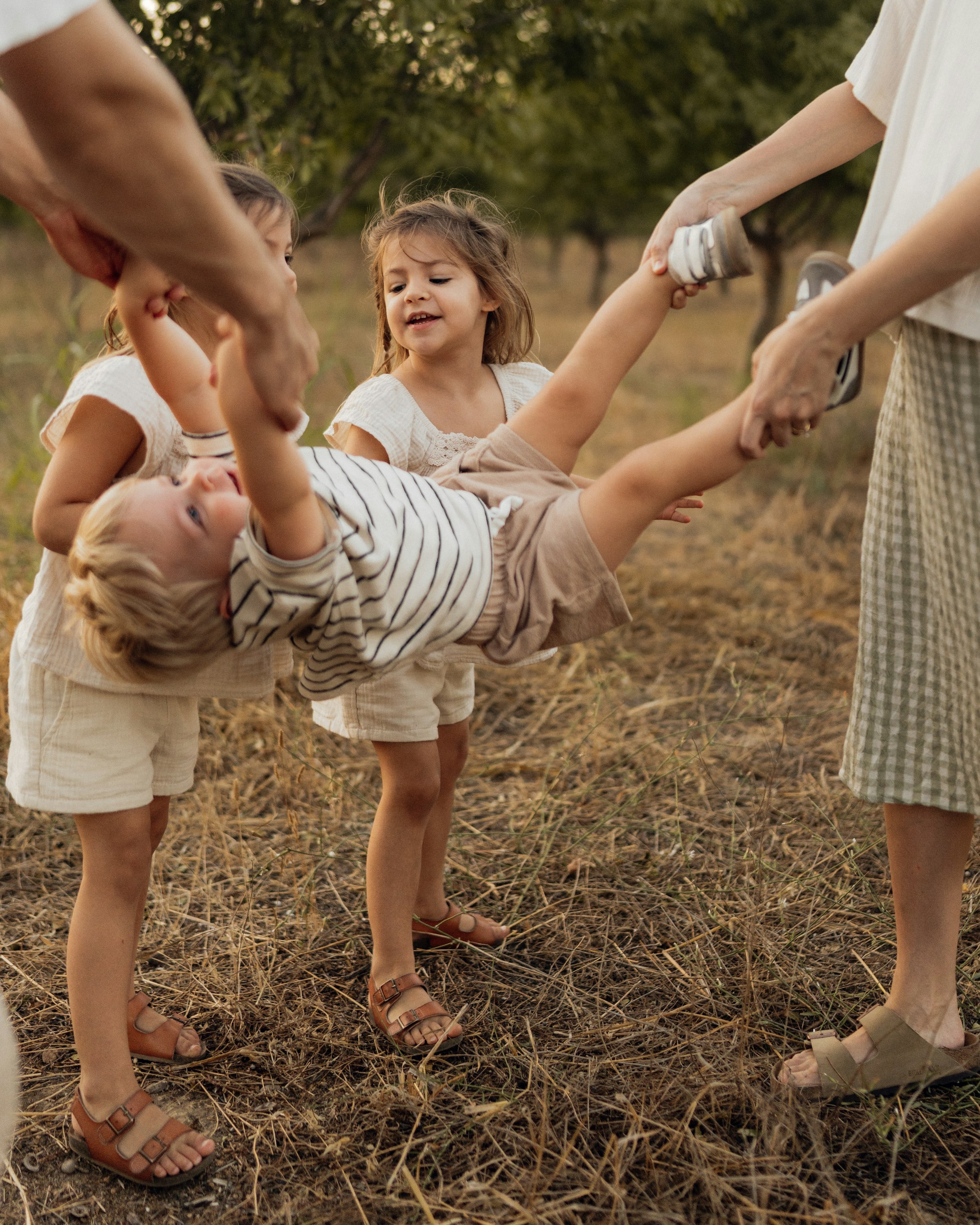 Children playing together outdoors in a grassy yard