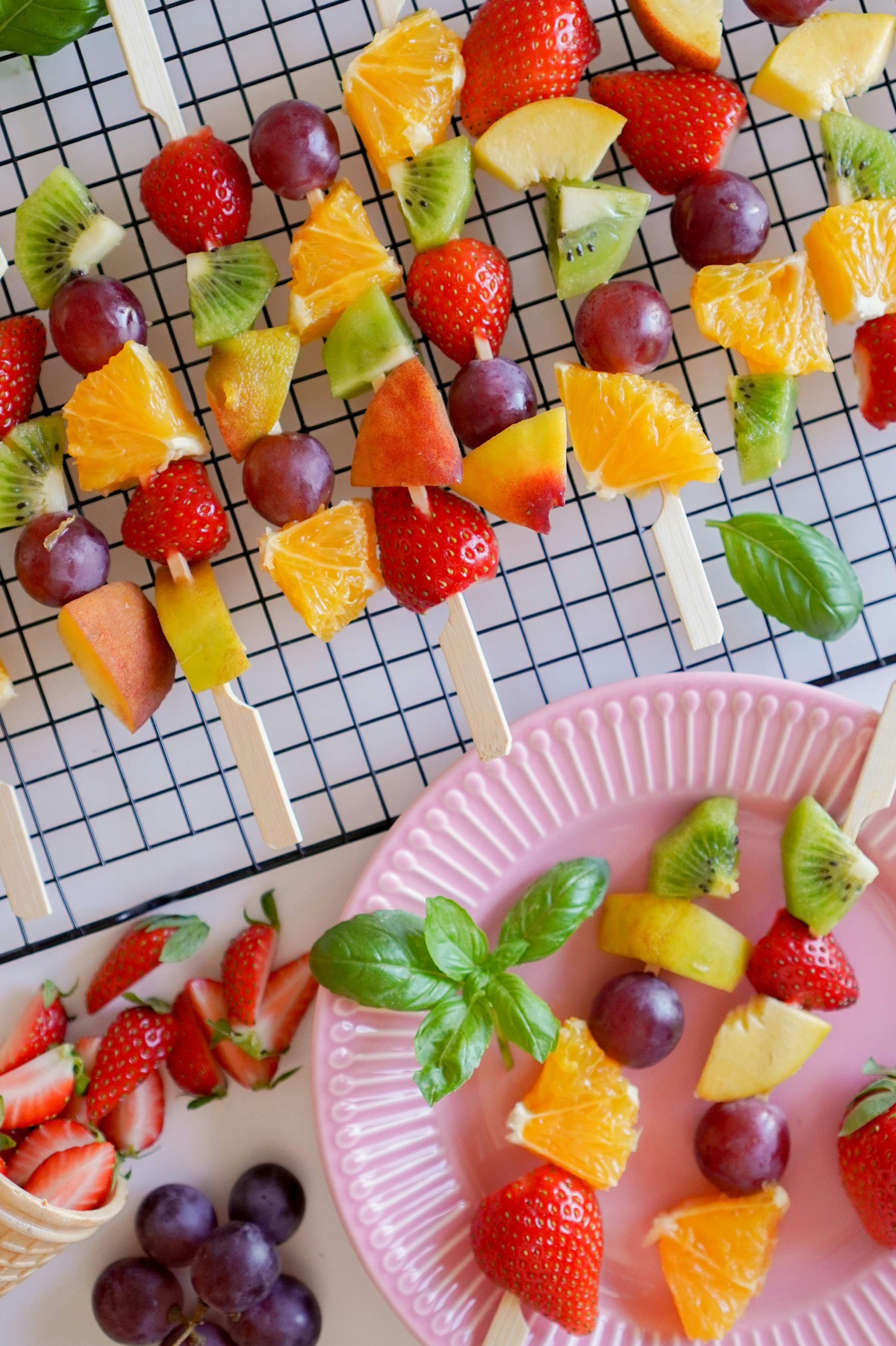 Sliced strawberries and bananas served on a plate